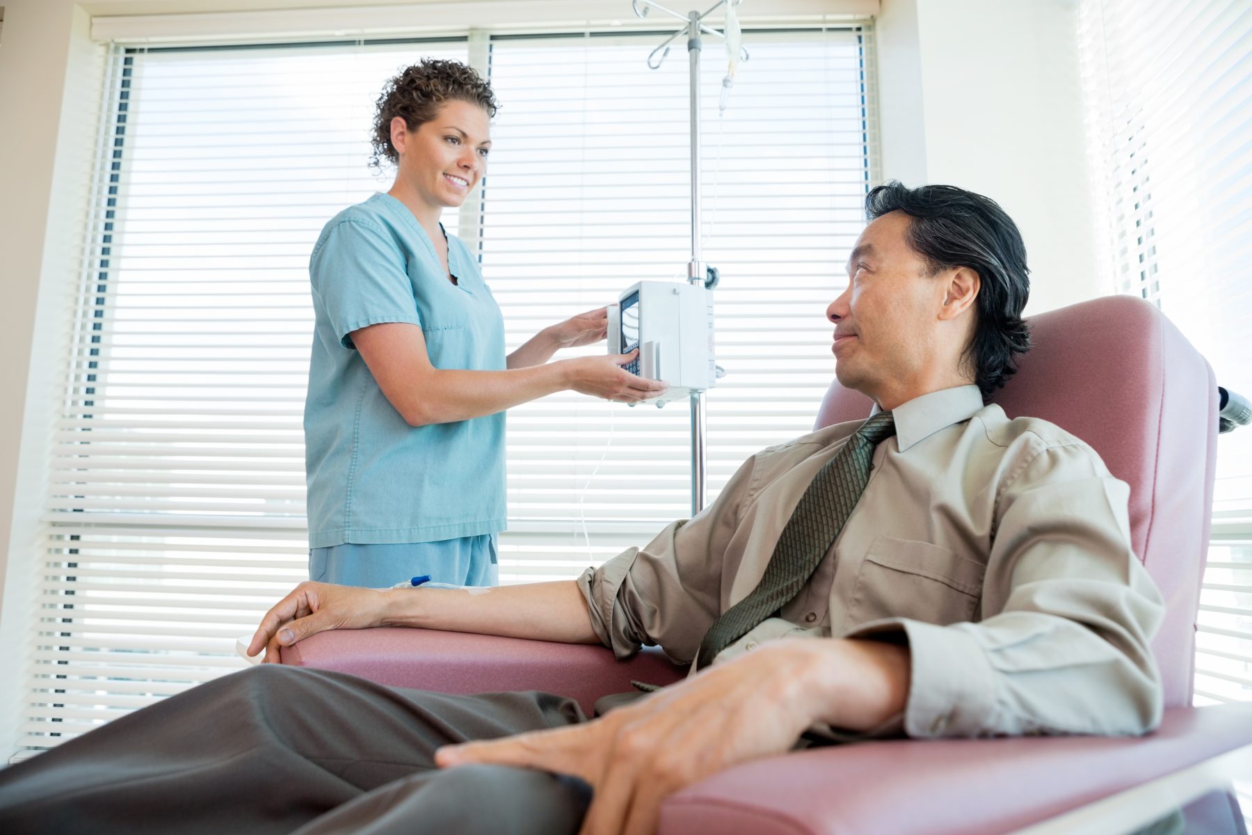 Patient receiving IV from nurse