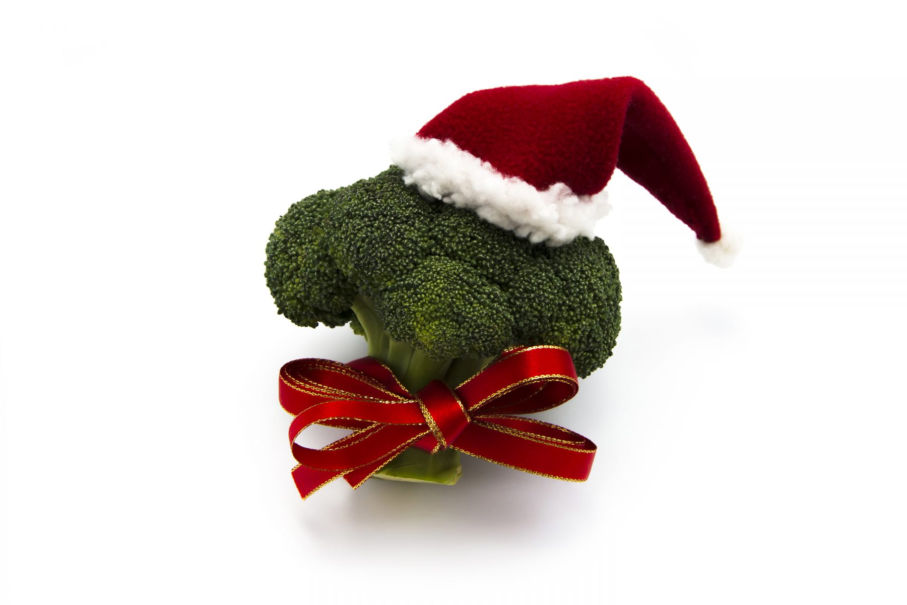 Healthy Christmas showing broccoli wearing a Christmas hat and ribbon