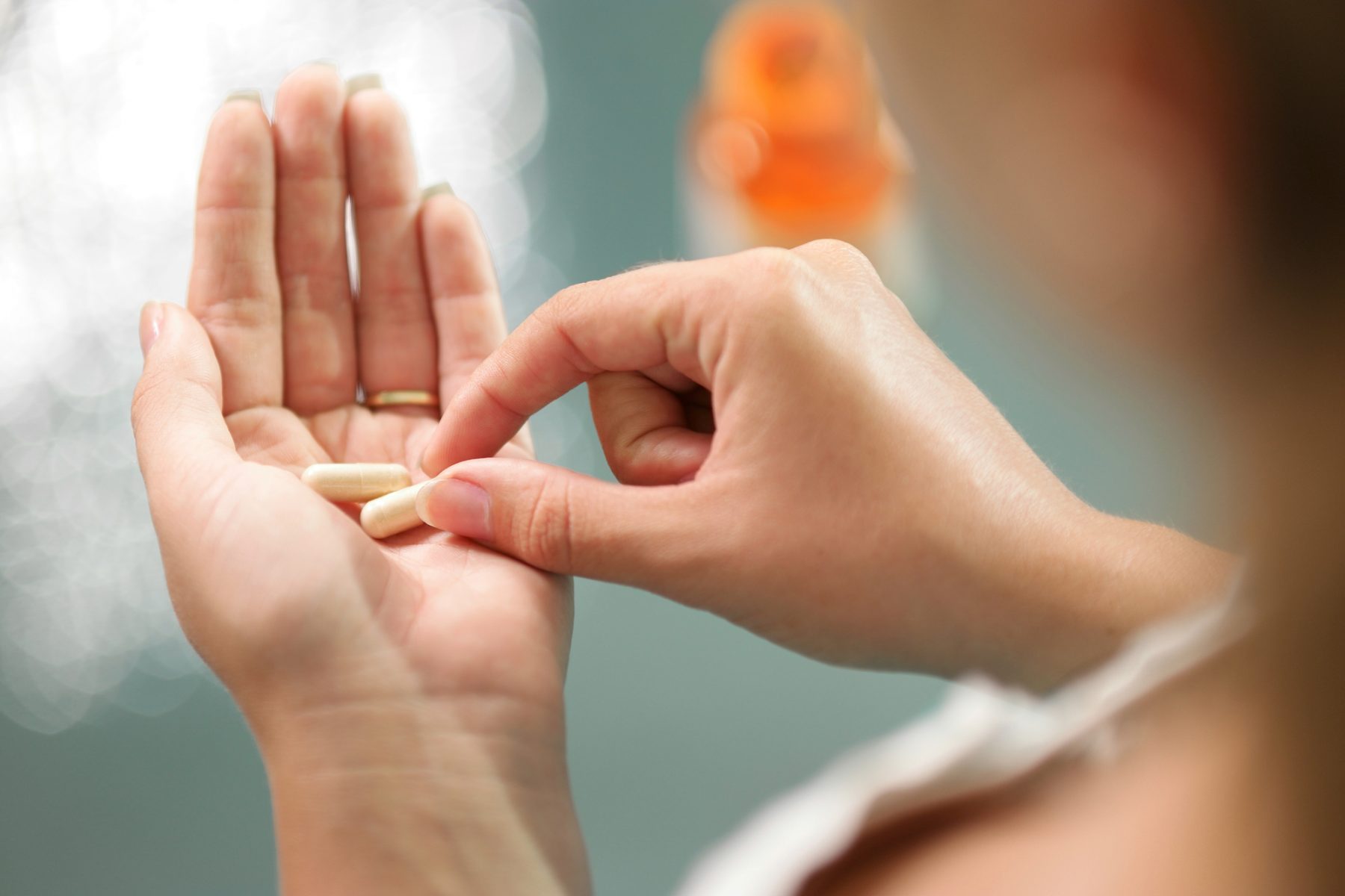 Woman taking ginseng supplements