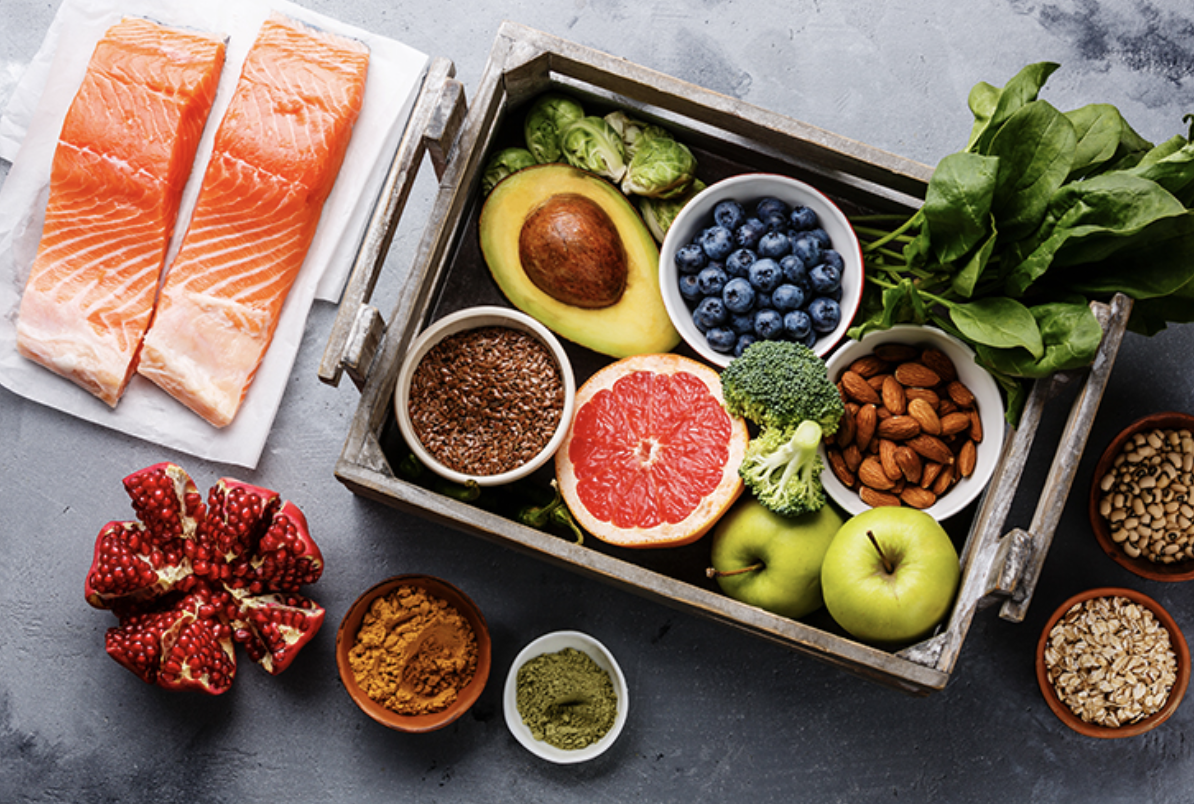 Foods full of vitamins arrayed on a tray and counter