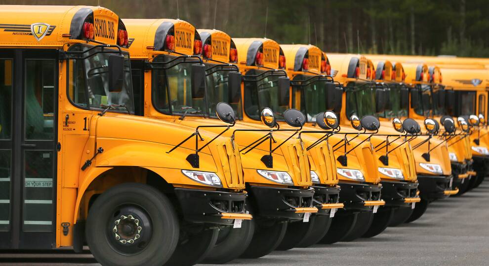 Yellow school busses in a row