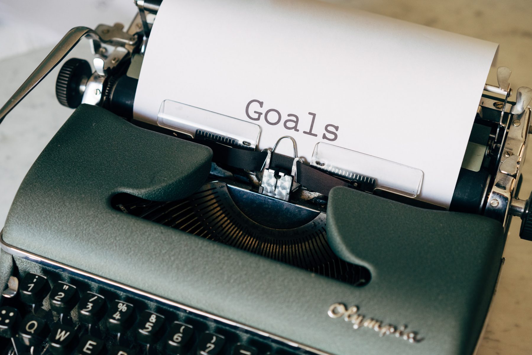 Typewriter with paper that says Goals