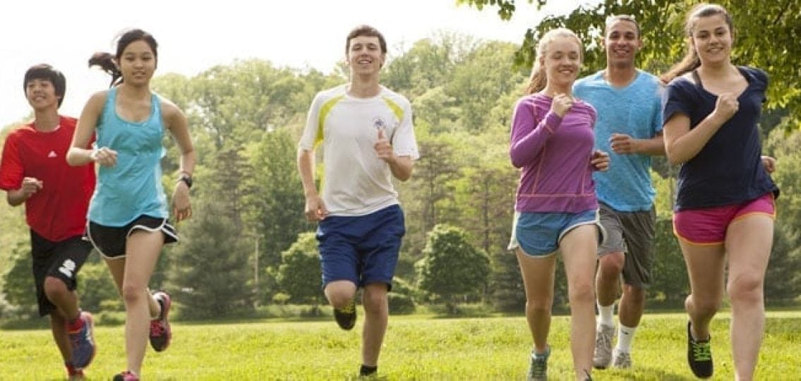 Teens working out together by jogging