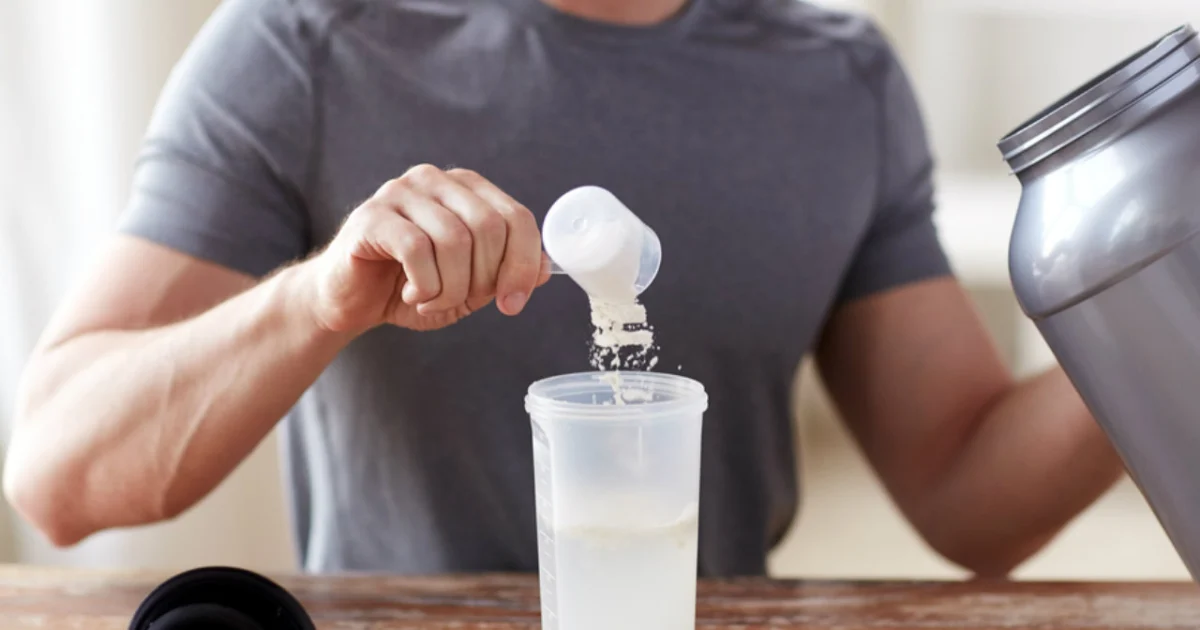 Man making protein shake