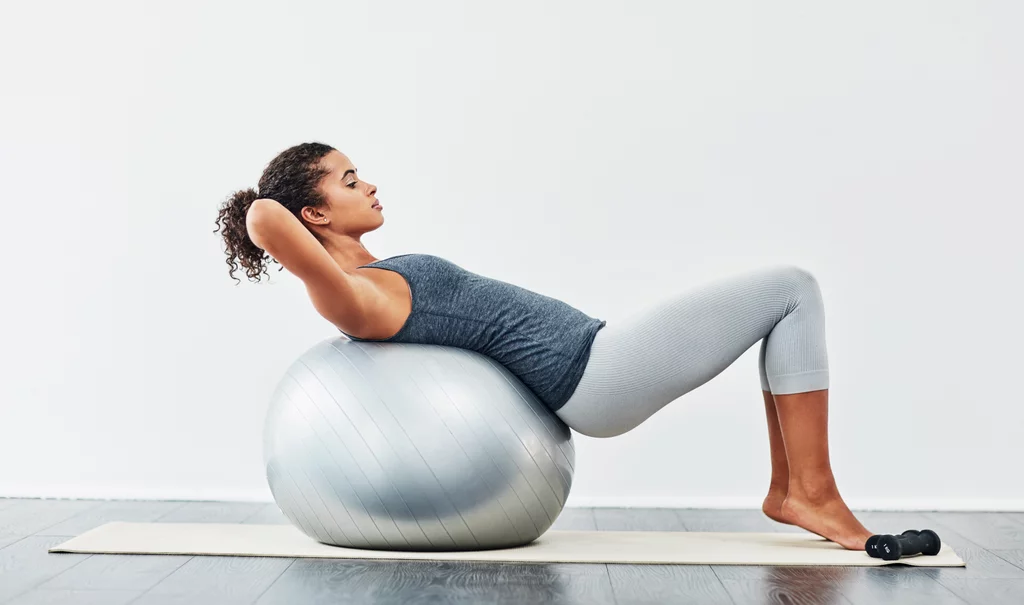 Woman using exercise ball to work out