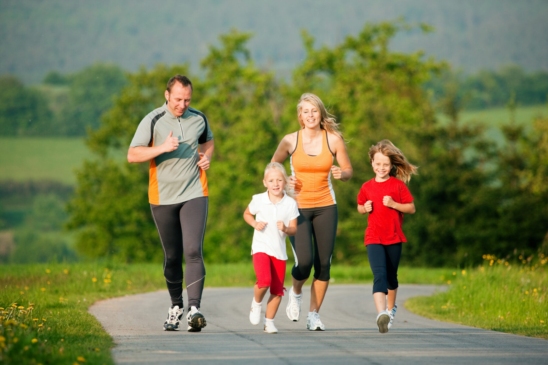 Family of different ages enjoying exercise time