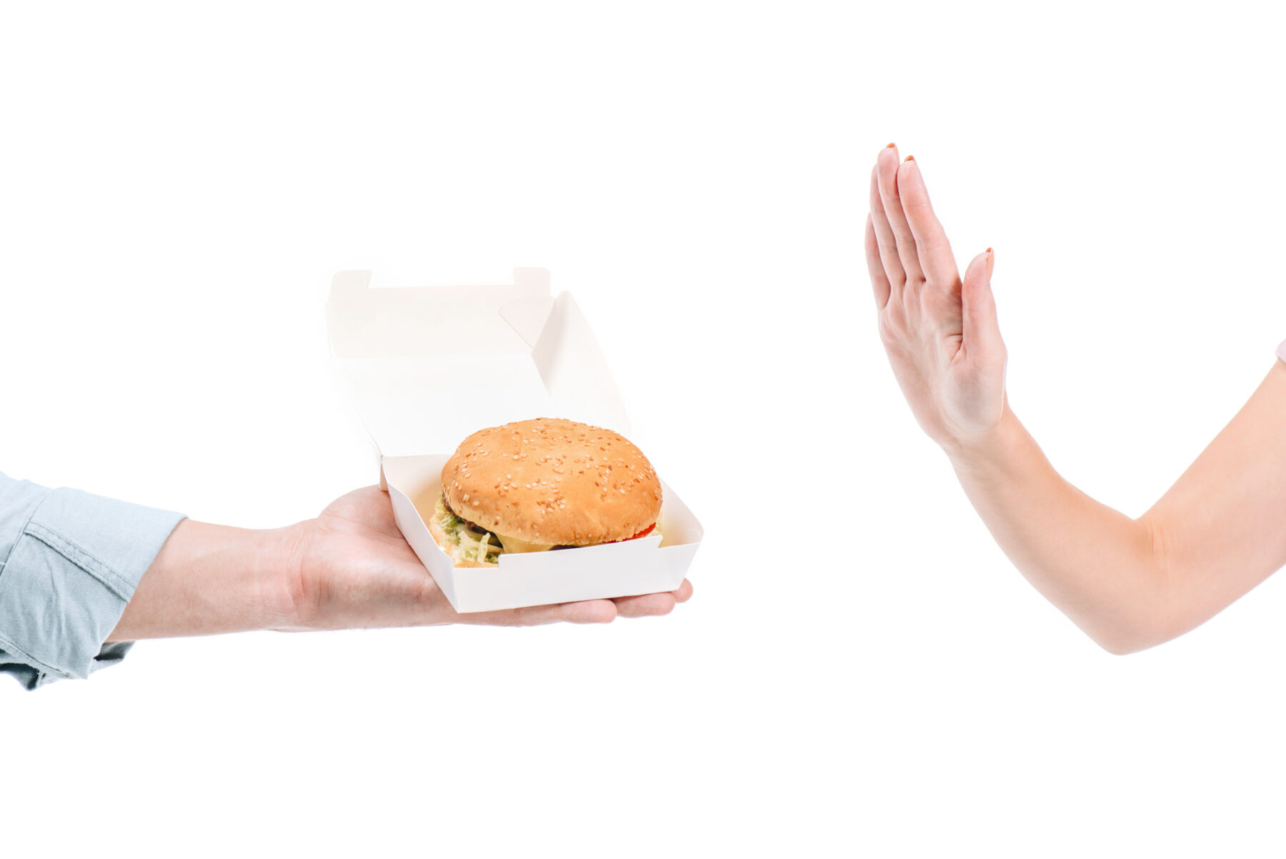 Fast food burger in wrapper that contains forever chemicals