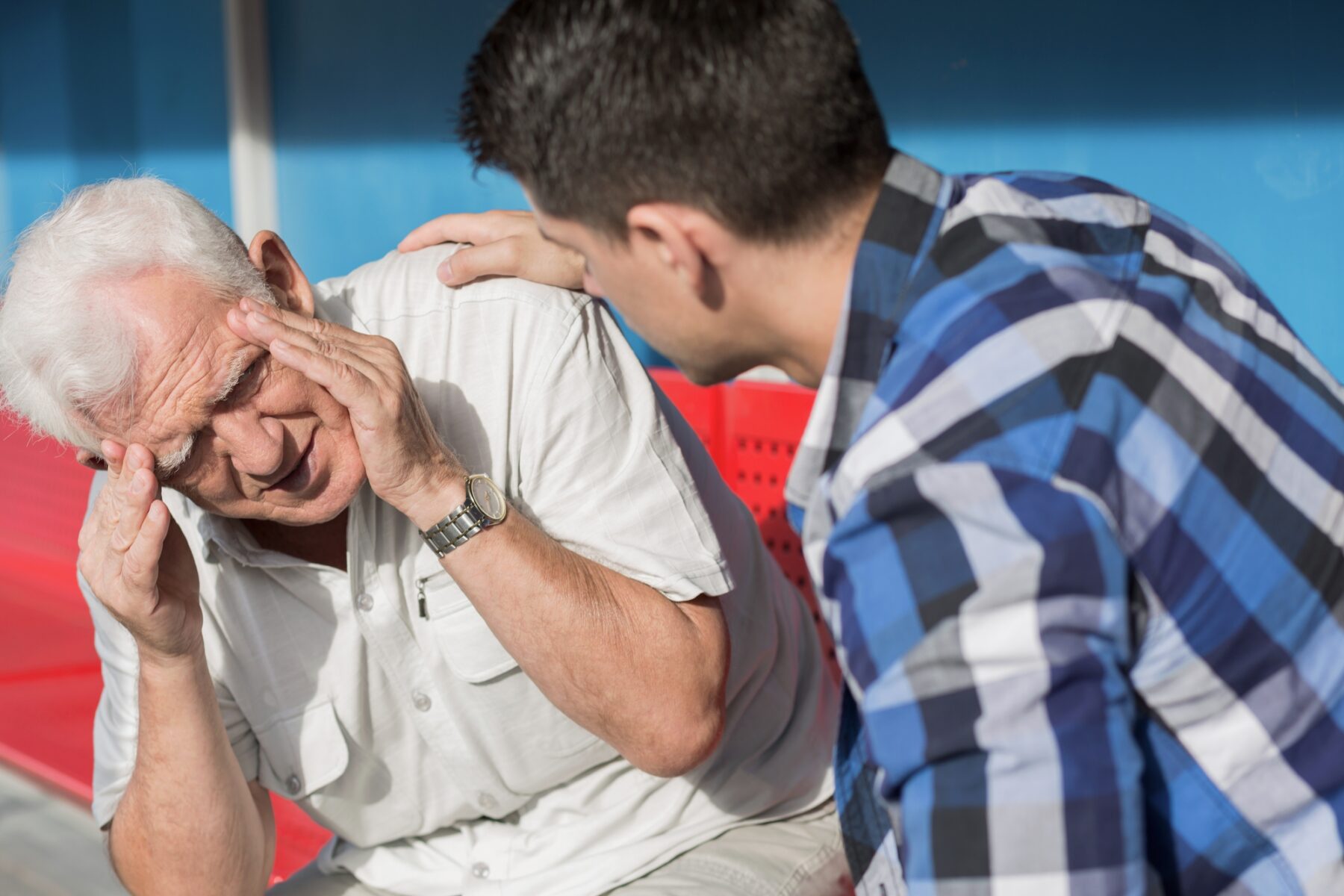 Vertigo sufferer being helped by his grandson