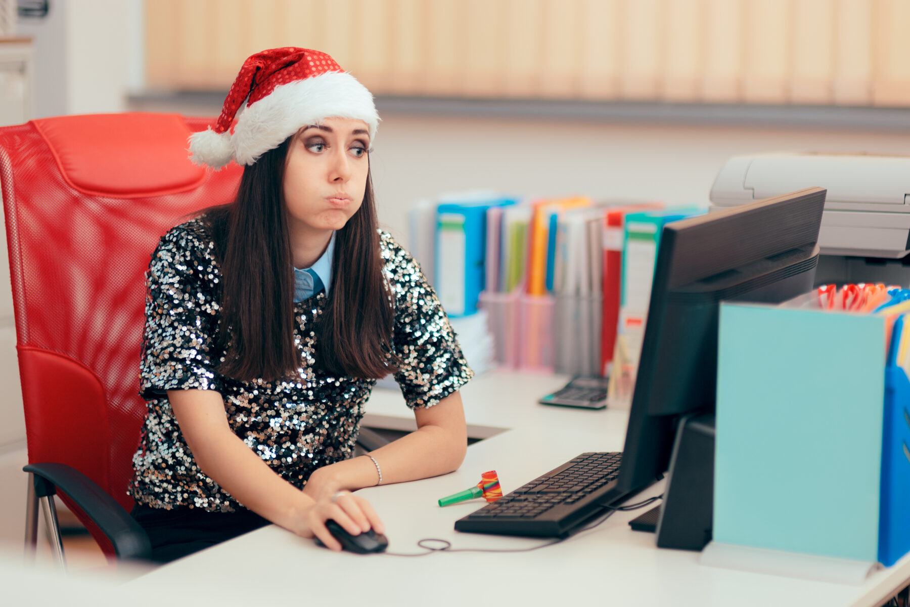 Tired woman at her desk after the holidays