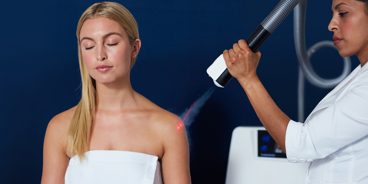 a woman receiving localized cryotherapy treatment in her shoulder